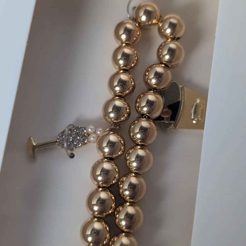 BaubleBar Champagne Celebration Themed Phone Charm Wristlet Gold Tone & Crystal